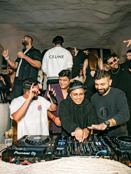 A group of friends having the time of their lives at Bastian. It's all about creating shared memories.