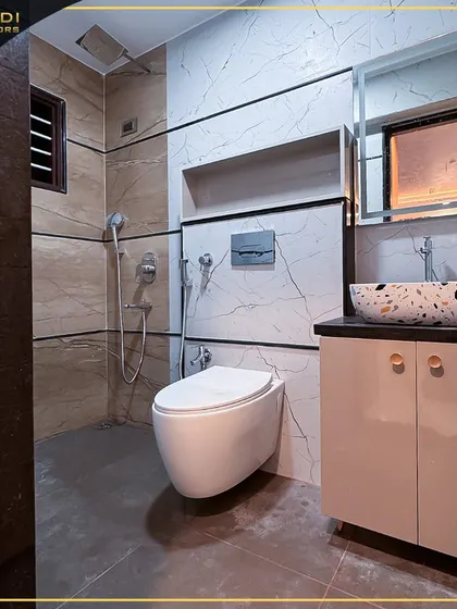 A stylish bathroom with a terrazzo-style vessel sink and a combination of marble and textured tiles. The design is clean, modern, and highly functional.