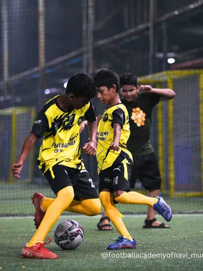 An intense moment captured during a practice match, with two players fighting for control of the ball.