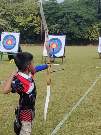 A young archer prepares to shoot at the SFA Archery Championship in Mumbai. Competitions are a great learning experience, teaching sportsmanship and performance under pressure.