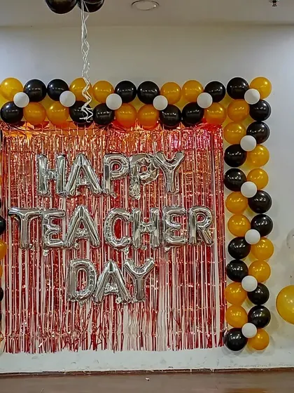 The full view of the Teacher's Day stage setup, ready for photos and celebrations.
