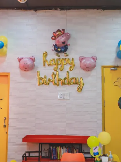 Simple yet festive Peppa Pig themed wall decor. We use foil balloons and character cutouts to decorate different areas of our venue, ensuring the party atmosphere is felt everywhere.