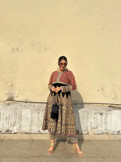 A full-length static shot of the printed Anarkali, showing its impressive volume and intricate patterns.