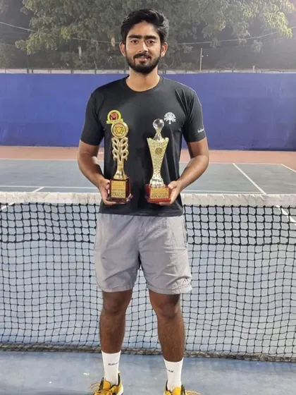Iftikhar with his singles finalist and doubles finalist trophies from Malda.