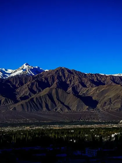 A wide, panoramic view of the Leh valley, with the formidable Himalayan range standing guard. This is the playground for our high-altitude training.