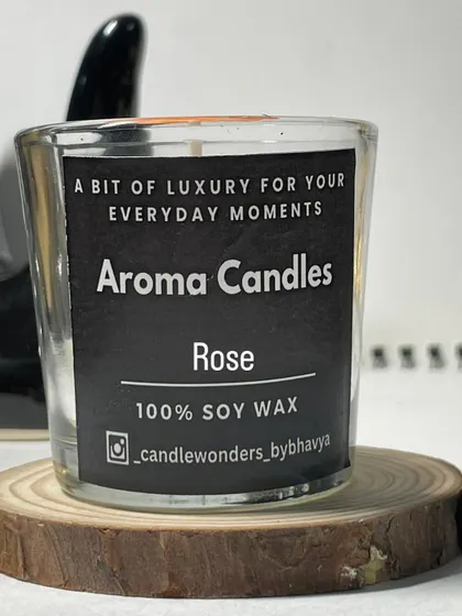 My glass votive candles are a simple and affordable option for favors. This one has a custom "Aroma Candles" label and is scented with rose.