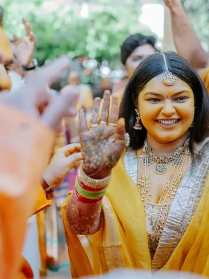 The Haldi ceremony is full of candid, joyful moments. Here, guests playfully apply turmeric to the bride and groom, and we are there to ensure the setting is as beautiful as the emotions.