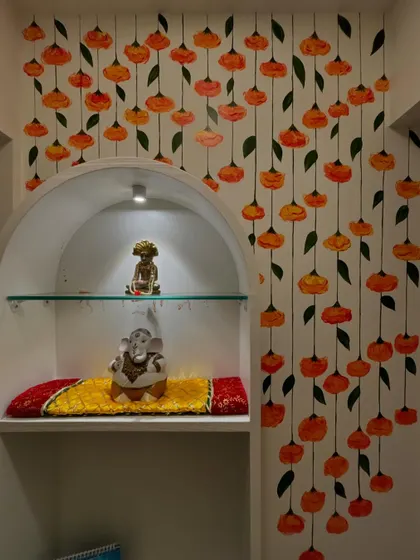 This mural of hanging marigolds was designed for a client's pooja corner in Mumbai. The goal was to create a feeling of constant celebration and auspiciousness in a sacred space.