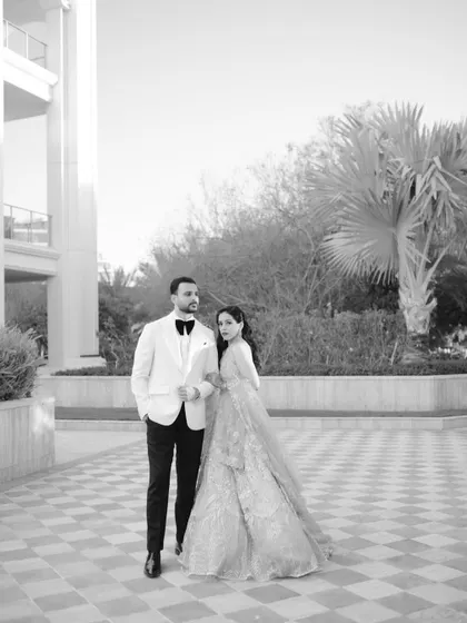 A sophisticated black and white portrait of Roha and Moin in Dubai, their formal attire perfect for an elegant evening reception.