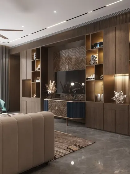 Functionality meets luxury in this family room's entertainment and display unit. We designed this full-wall custom cabinetry with integrated lighting to beautifully showcase art pieces and awards, while neatly housing the media center.