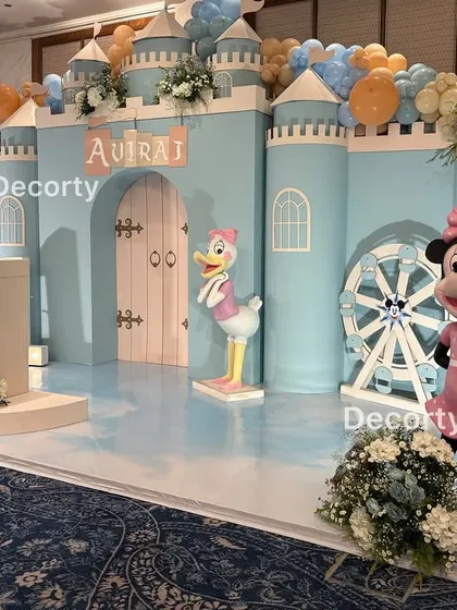 The Disneyland castle stage featuring Minnie Mouse and Daisy Duck, ready for a princess-worthy celebration.