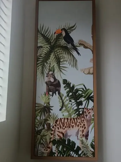 The third panel in the series, showing a toucan and a leopard in a lush jungle. This type of framed wallpaper art is a modern and flexible way to decorate.