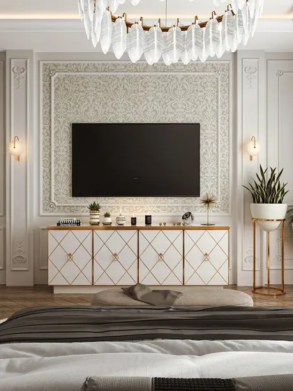 This neoclassical bedroom design exudes elegance. The wall paneling, ornate TV console with gold accents, and a grand crystal chandelier create a luxurious and timeless sleeping space.