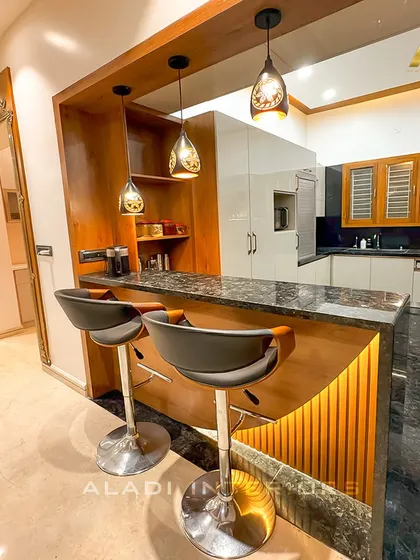 A beautifully framed view of the kitchen from the living area, highlighting the breakfast bar as a social hub that connects the different zones of the home.