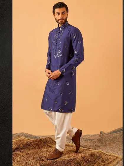 This royal blue kurta with scattered mirror work is a perfect blend of tradition and modernity. It’s a standout piece that is both festive and sophisticated.