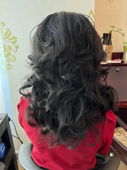The back view shows the volume and movement created by the shag layers.