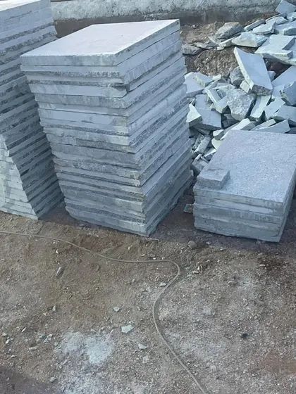 Stacks of machine-cut Bangalore stone pavers. I can supply these in various standard and custom sizes.