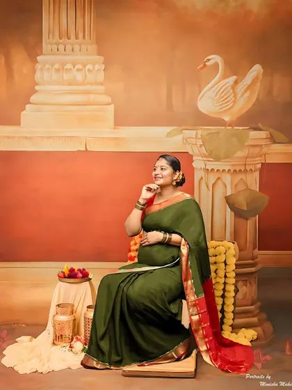 Inspired by vintage Indian art, this portrait with an olive green saree and traditional props is perfect for those who love a classic aesthetic.