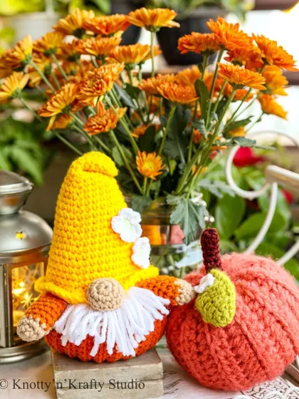 Welcoming the cozy season with my whimsical autumn decor. This little Pumpkin Gnome, with his fluffy white beard and pointy yellow hat, sits beside a crochet pumpkin, bringing the warm colors of fall right into your home.