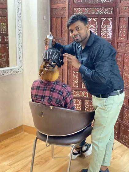 Here I am putting the finishing touches on a stylish, modern updo. This look combines sleek lines with textured elements for a very chic result.