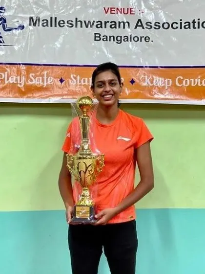 Maria Rony with a championship trophy, celebrating another major win.