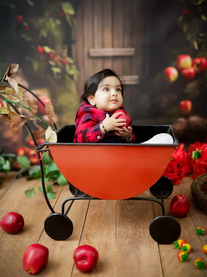 A thoughtful moment in the apple cart. Even quiet moments are beautiful in these creative, themed sessions.