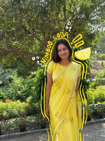 Feeling as fresh as nimboo soda in this bright yellow saree. The doodles add a zesty, fun element.