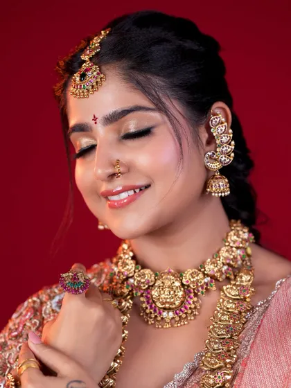 The beauty is in the details. This shot highlights the soft, blended eyeshadow and perfectly defined features that complete a South Indian bridal look, ensuring the bride feels confident and beautiful.