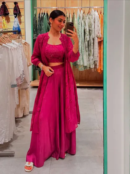 This magenta co-ord set with a matching long jacket is another versatile festive option. You can wear it as a full set or style the pieces separately.