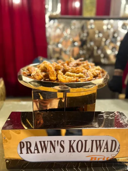 A platter of Prawns Koliwada, elegantly presented at a buffet station.