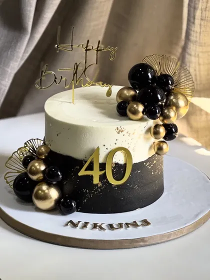 Stepping into the fabulous forties in style! This elegant black and gold masterpiece celebrates a milestone birthday with shimmering accents and a bold, sophisticated design.