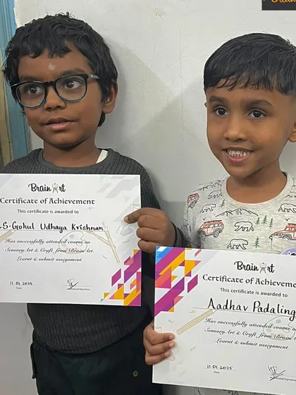 Two of our sensory art students proudly holding their Certificates of Achievement. This marks a fantastic milestone in their creative journey, and we can't wait to see what they do next.