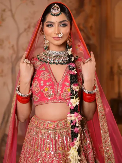 The bride adjusts her dupatta, giving a glimpse of her complete look. The makeup is designed to be stunning from every angle, ensuring she looks perfect throughout her special day.