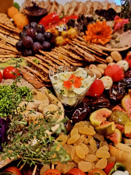 Fruit, vegetables and crackers fill this close-up of our platter, with little bowls of dips nestled among the bites.