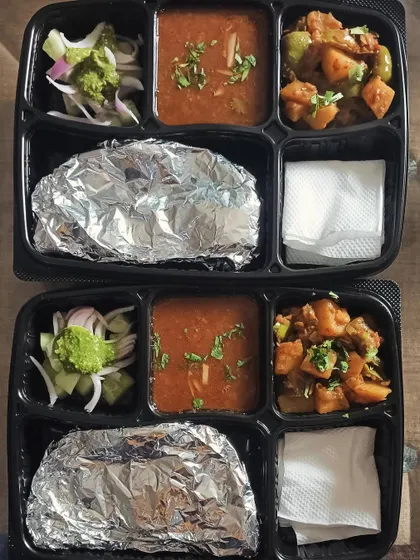 A classic homestyle meal of aloo capsicum sabzi and a simple dal. This is the perfect light and healthy tiffin for your daily office lunch.