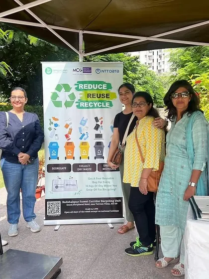 Our team and volunteers from Team Green Brigade stand by the recycling banner at the RPS International School waste collection drive.