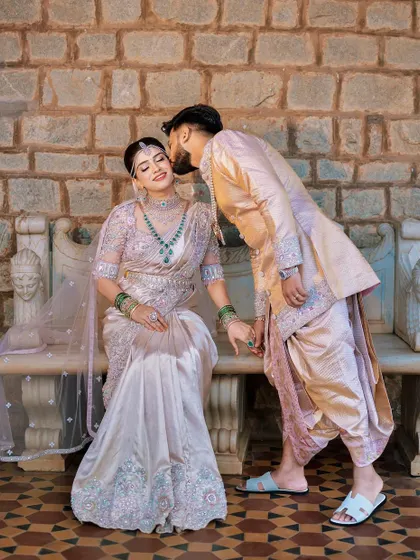 Another angle of this romantic couple. The groom's pastel sherwani and dhoti combination is a unique and stylish choice, perfect for a memorable pre-wedding shoot.