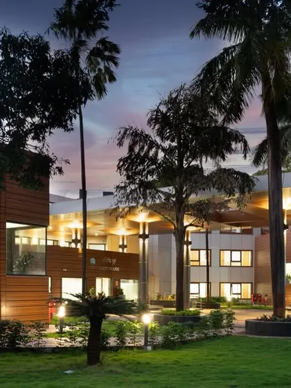 The guest house viewed from the lawn, showing the new facade and the relationship between the building and its landscape.