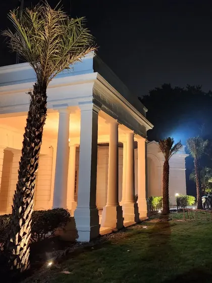 Another angle of the illuminated landscape, showing how lighting transforms the property at night, enhancing its beauty and security.