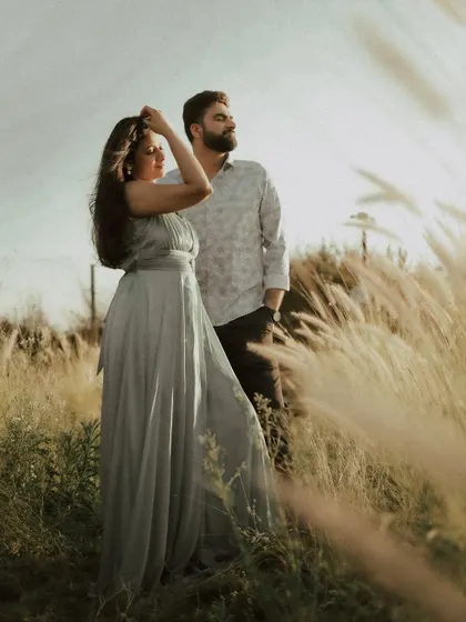 The wind catching her dress in a field at sunset. I look for these natural, dynamic elements to add life and movement to your photos.