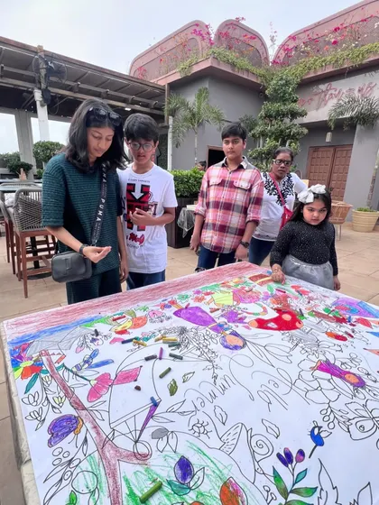 Our giant doodle mats are a party highlight. Kids of all ages gather around to color in a large, themed illustration together, making it a perfect collaborative and ice-breaker activity.