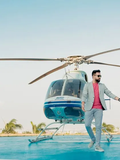 Making a grand entrance into their new life together. This stylish shot from a helicopter pre-wedding shoot in Pune is the definition of luxury and modern romance, creating an unforgettable memory.