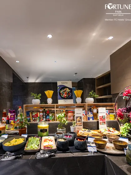 The salad and cold cuts section of our buffet, offering a healthy and refreshing start with a variety of greens, dressings, and imported cheeses.