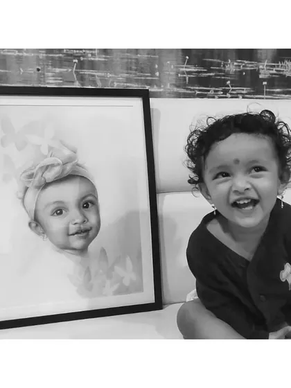 Another happy baby next to her finished portrait. I love seeing my art bring smiles to families.