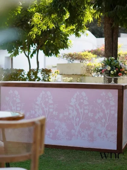Even the bar front was customized with a delicate floral print, ensuring that every single element of the event tied into the 'Bloom Grace' theme.