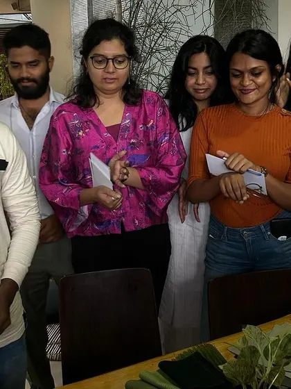 Team members receiving certificates or materials at the end of the workshop.