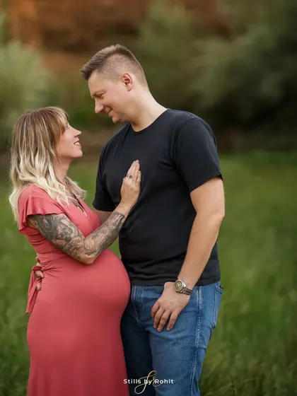 The same loving gaze, captured from a slightly different angle to emphasize the emotion. These candid couple shots are a beautiful part of any maternity session.