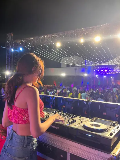 No event is too big. This shot captures me at the console during a massive Dandiya night, with thousands of people dancing under the festive lights.