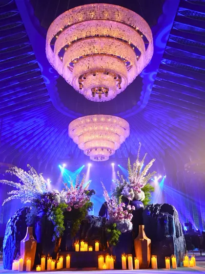 Grand chandeliers and dramatic floral arrangements set the stage for our Sufi Night. The lighting design was crucial in creating the immersive, atmospheric experience.
