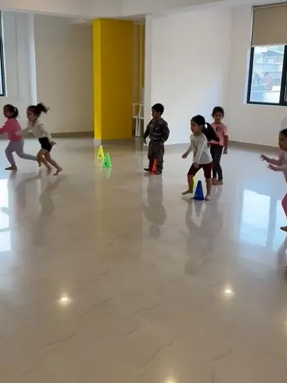 An action shot of our indoor class, with kids running through a cone drill. We keep the pace upbeat and the activities varied to ensure everyone stays engaged.